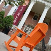 Adirondack chair in front of Seibert Hall.