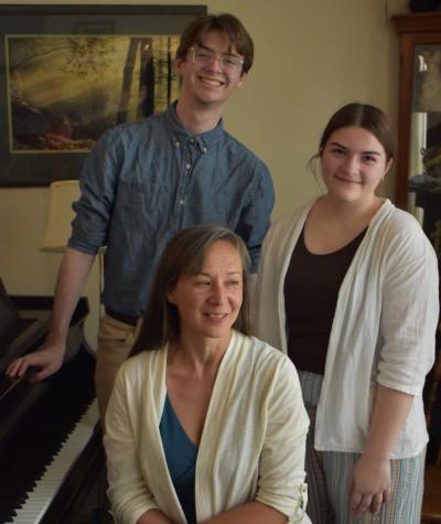 Pictured are Naomi Niskala, associate professor of music, seated at piano; Emily Erdman '25, left; and Andrew Dirienzo '25, right.